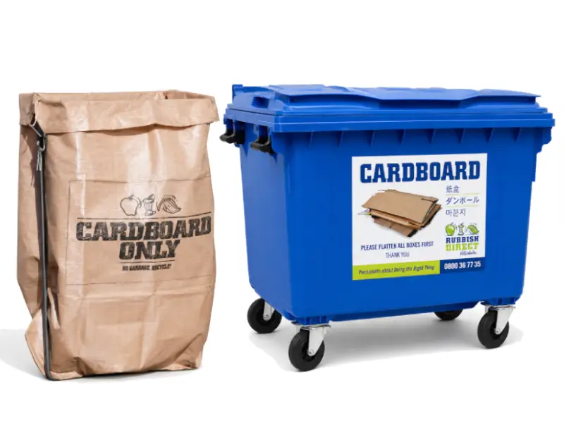 Brown Paper Bag Labeled aposcardboard Onlyapos Next to a Blue Cardboard Recycling Bin on Wheels