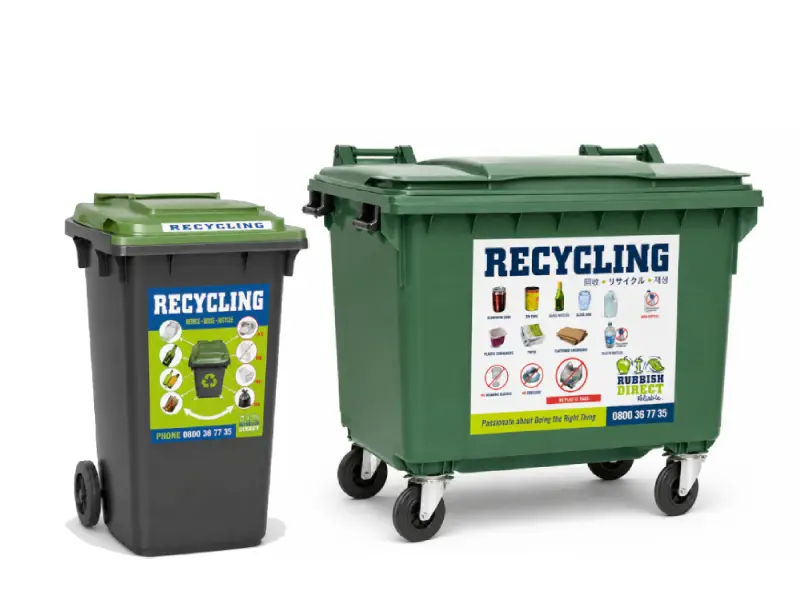 Two Recycling Bins a Small Gray Bin with a Green Lid and a Large Green Wheeled Bin Both Labeled Recycling with Icons Indicating Recyclable Items