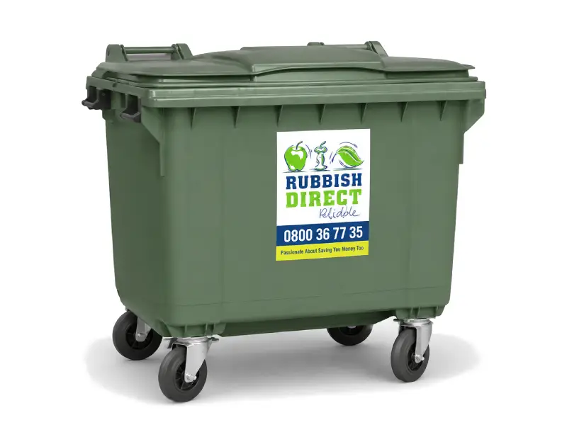 Green Wheeled Rubbish Bin with a Rubbish Direct Label and Phone Number on the Front Edge of the Lid Area Ready for Pickup or Disposal